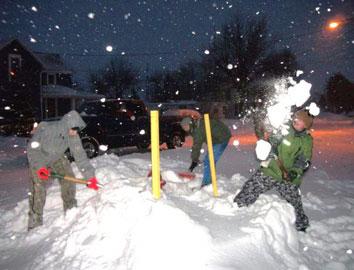 1-24-10 Scout remove snow from hydrants